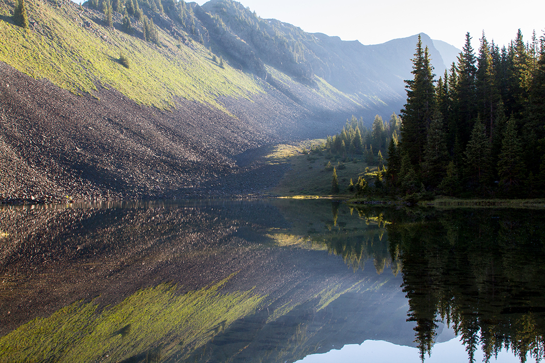 Landscape photograph of a sunrise at a small pond in the Weminuche Wilderness Colorado