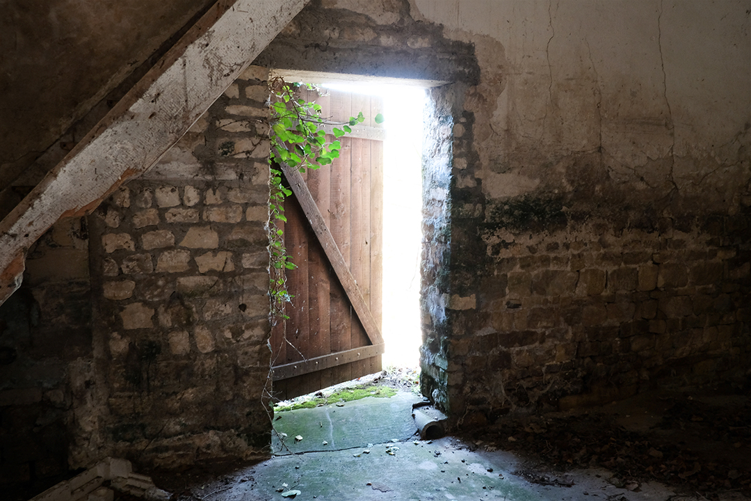 Photograph from inside of an abandoned farm near Omaha Beach in Normandy France 